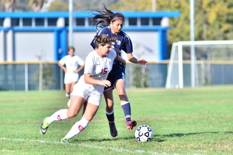 Comet defender Nazrana Khan battles for possession of the ball against a Renegade forward during CCCs 5-0 loss to Bakersfield College at the Soccer Field on Friday.