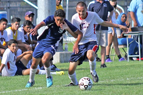 Comet right winger Missael Hernandez battles for the ball against Beavers defender Esteban Gonzalez during CCCs 1-1 draw against American River College at the Soccer Field on Sept. 16.