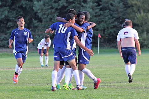 The Comets soccer team celebrates Carlos Munozs goal in the 88th minute of CCCs 1-1 draw against American River College at the Soccer Field on Sept. 16.
