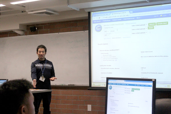 Library department Chairperson Andrew Kuo (center) explains search phrases while nursing major Elijah Fernandez (left) looks on during the Searching Online Databases workshop on Sept. 17 in LLRC-107.