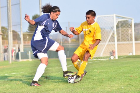 Comet forward Kaleb Aguilar (left) keeps possession of the ball during the first half of CCCs 3-1 win against Chabot College at the Soccer Field on Friday.