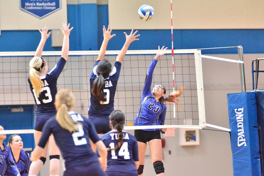 Comet+outside+hitter+Rachelle+Cuevas+%28right%29+attempts+to+loft+the+ball+over+the+net+toward+49er+outside+hitter+Victoria+Helm+during+CCCs+loss+to+Yuba+College+in+the+Gymnasium+on+Friday.