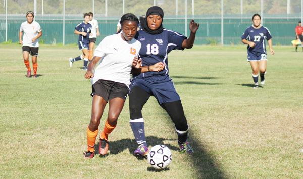 Lassen midfielder Jordain Shedrick (left) challenged defender Taheerah Brewes (right) for possession of the ball during CCCs loss to Lassen College at the Soccer Field on Sept. 5.