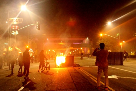 A dumpster sits on fire during a protest in Oakland, Calif., on Tuesday, Nov. 25, 2014. a day after a Missouri grand jury decided not to indict white police officer Darren Wilson in the fatal shooting of black teenager Michael Brown in Ferguson, Mo.