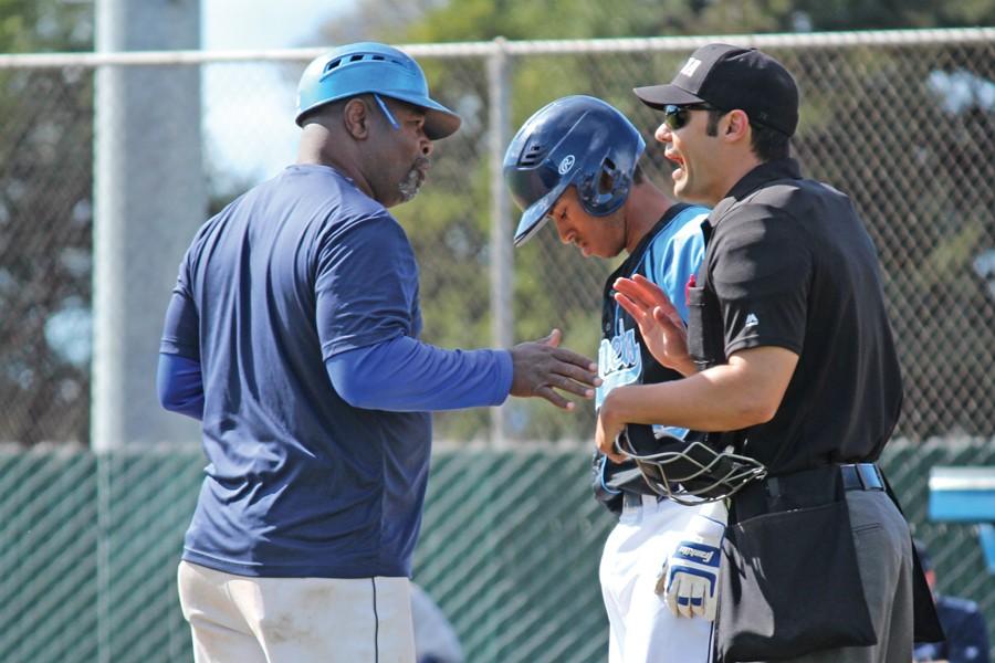 Baseball coach Marvin Webb (left) challenges a call the umpire made after third baseman Lumus Russell was apparently hit by a pitch, during CCC’s 7-4 loss to Mendocino College at the Baseball Field on Saturday.
