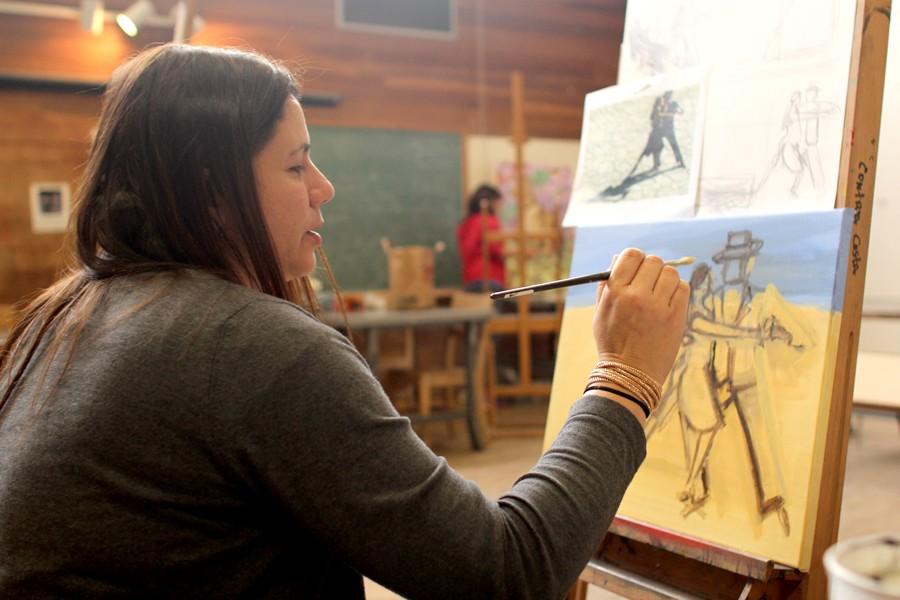 Early childhood education major Michal Sarang Schmoisman thoughtfully works on a painting during her Art 124 class in A-6B on Feb. 19. Schmoisman immigrated to the United States to pursue a better life for herself and her children. 