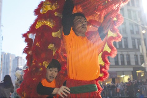 Two performers inside a lion continue on their route for spectators
during the Southwest Airlines Chinese New Year Festival and Parade
between Bush and Pine Streets in San Francisco on Saturday.
