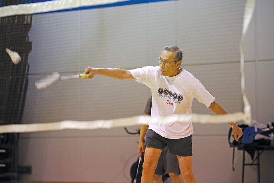 Eighty-three-year-old El Cerrito resident Hok Gouw plays badminton in the Gymnasium on Monday. 