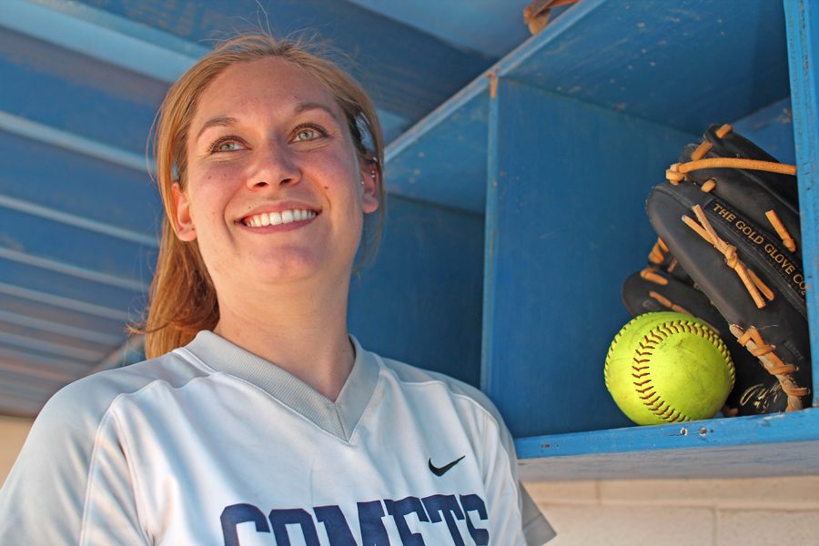 Comet pitcher Anna Palter lends supporting advice to her squad during a difficult season. 