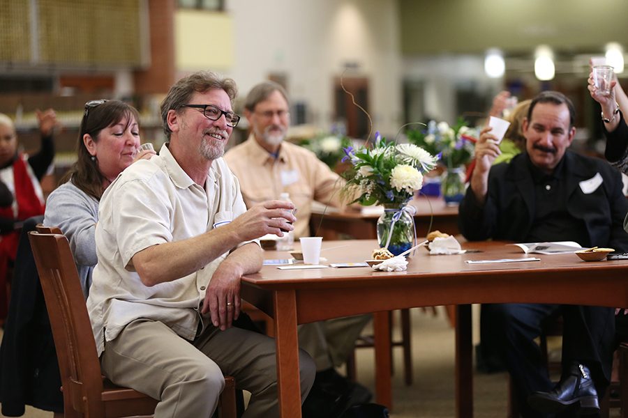 Automotive services professor Peter Lock (left) and others in attendance raise their glasses to salute Lock’s time spent at the college during the annual Retirement Reception and Staff Reunion hosted in the Library and Learning Resources Center on May 6. 
