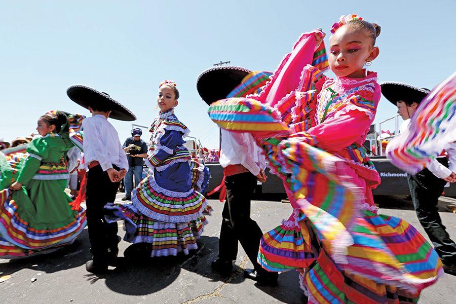 Dancers with Danza Azteca Guadalupana perform for the crowd during the Cinco de Mayo Festival on 23rd Street on Sunday.