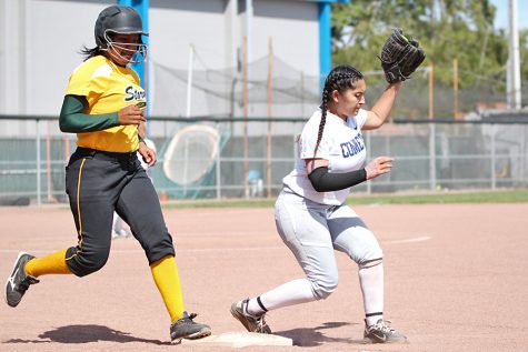 Comet first baseman Amy Palomares (right) puts out Storm infielder Briana Reason during CCC’s doubleheader loss to Napa Valley College  on April 26. 