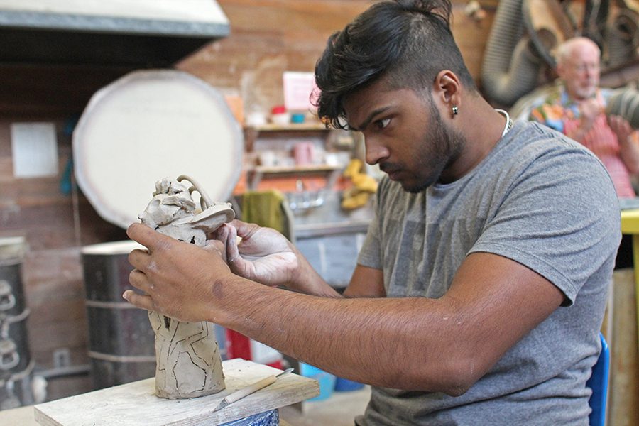 Art major
Shenal 
Amarasinghe
concentrates on shaping a clay sculpture in his Sculpture: Beginning II class in A-6 on  
April 13.
Amarasinghe plans to move to Los Angeles to work in movie 
production after he 
graduates next year
from Contra Costa College.