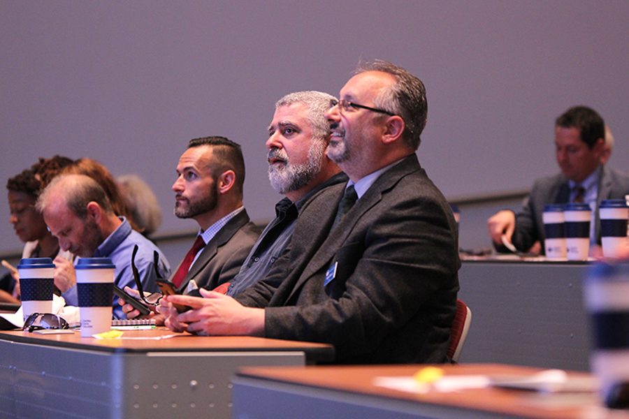 (L to R) Senior Executive Assistant Michael Peterson, English, philosophy and humanities professor Jeff Michels and Liberal Arts Division Dean Jason Berner watch a demonstration powerpoint during the semi-annual All College Day event in GE 225 on Aug. 11.