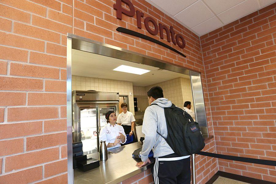 Criminal justice major Aaron Hernandez (right) puts in his order to culinary arts major Elizabeth Rago (left) at Pronto in the Student and Administration Building on Aug. 29.