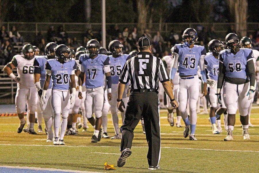 A referee delivers the verdict of a penalty call against the Comets during CCC’s 21-20 loss to Laney College at Comet Stadium on Saturday.
