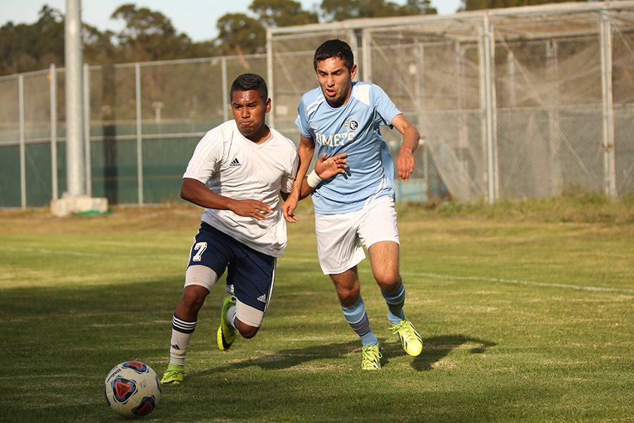 Comets forward Francisco Fernandez and 49ers defender Isaac Rodriguez battle for possesion of the ball during CCCs 3-0 win against Yuba College at the Soccer Field on Oct. 7.