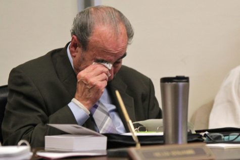 District board Trustee John Marquez weeps after sharing a story about fellow Trustee John T. Nejedly during the district Governing Board meeting in Martinez on Oct. 12.