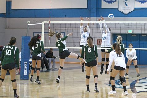 Storm outside hitter Mariah Leal (middle left) hits the ball past Comet blockers Jacqueline Tianero and Alejandra Galvez during CCC’s 3-0 loss against Napa Valley College on Friday in the Gymnasium.