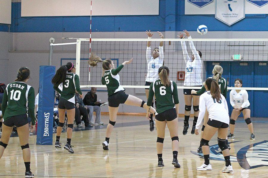Storm outside hitter Mariah Leal (middle left) hits the ball past Comet blockers Jacqueline Tianero and Alejandra Galvez during CCC’s 3-0 loss against Napa Valley College on Friday in the Gymnasium.