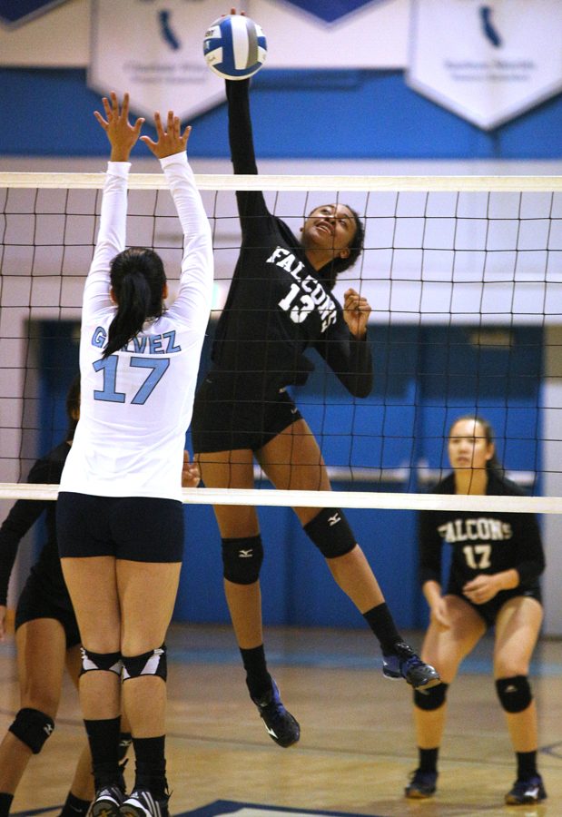 Falcons middle hitter Tori Owens spikes the ball past Comet middle blocker Alejandra Galvez during CCC’s 3-0 loss to Solano College in the Gymnasium on Saturday.