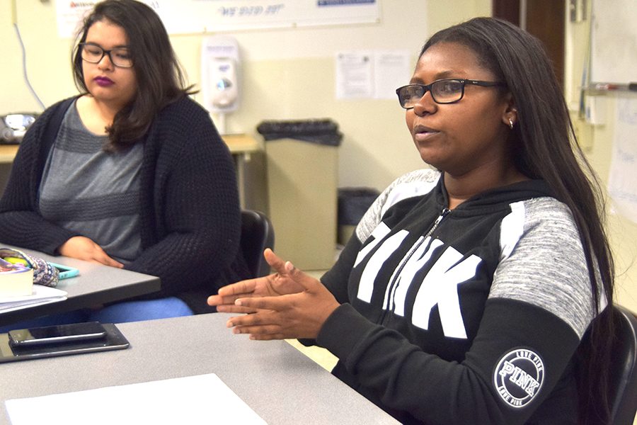 Film major Courtney Chappell (right) speaks to English major Mickayla Burgos and the rest of the Student In Action club members in AA-219 on Oct. 12. 