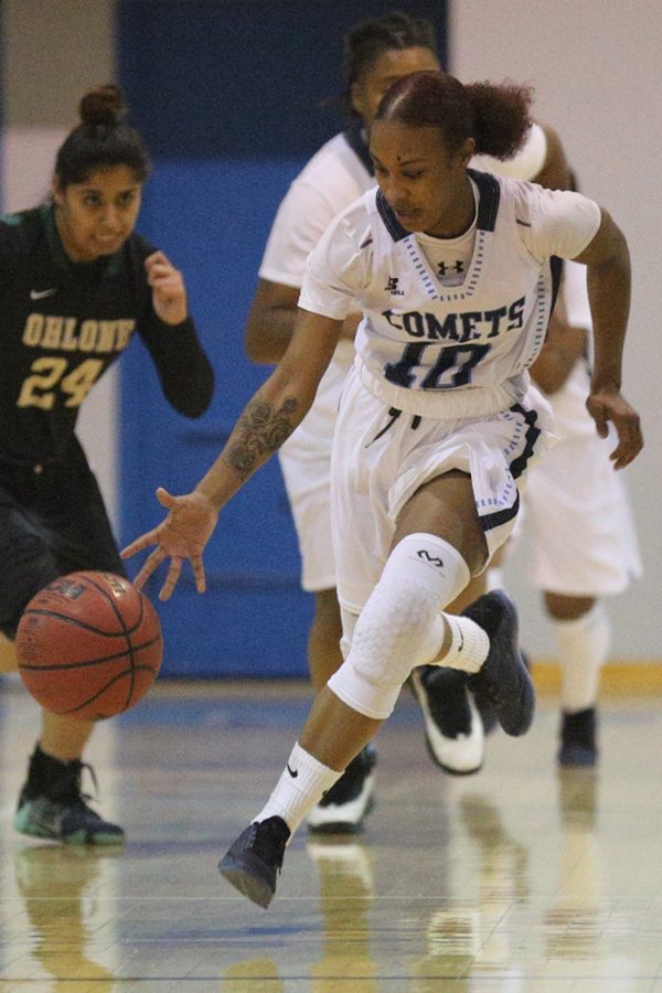 Comet point guard Azanae Lewis dribbles up the court during the 23rd Annual Comet Classic womens basketball tournament in the Gymnasium on Friday.