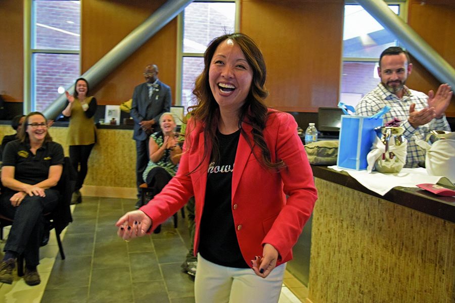 Former Contra Costa College Vice President Tammeil Gilkerson smiles as staff, faculty and students clap for her during her farewell reception in Aqua Terra Grill on Thursday.  