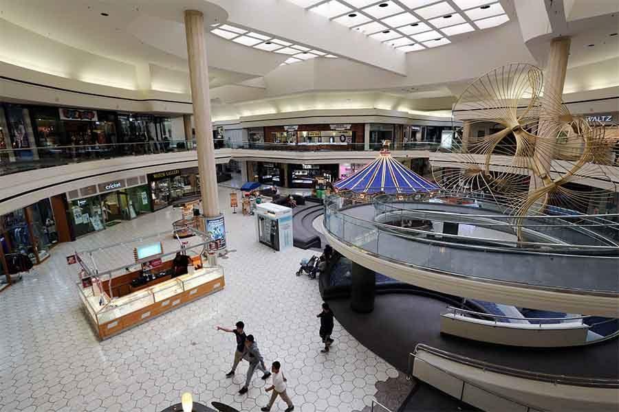 Few shoppers browse through the nearly empty Hilltop Mall on March 17. The number of shoppers at Hilltop Mall has steadily declined as storefronts become vacant despite Richmond Mayor Tom Butt’s projection of future economic infusion.