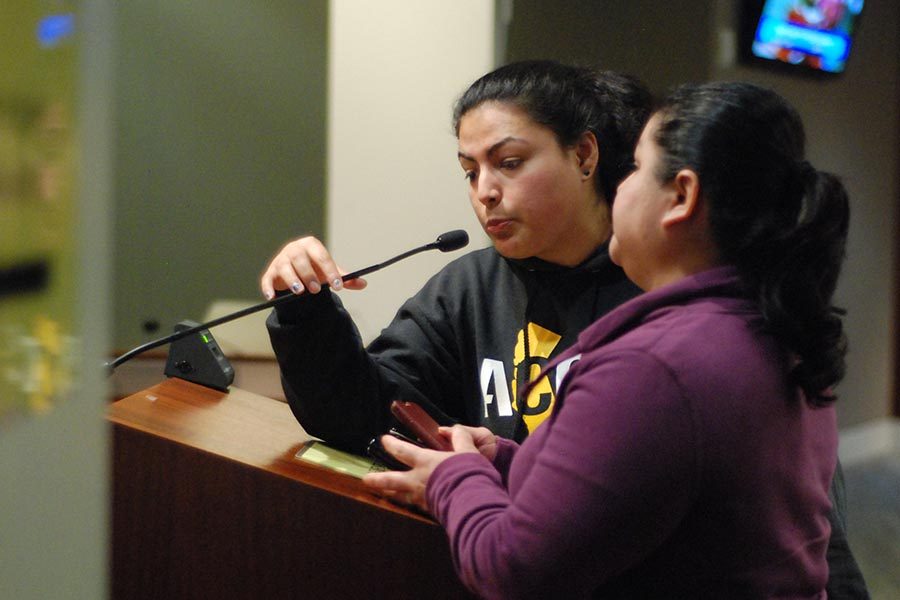 denis perez / The Advocate
Community organizer Edith Pestrano translates for pro-rent control speakers during the Richmond Council meeting in Richmond, Calif. on March 7. 