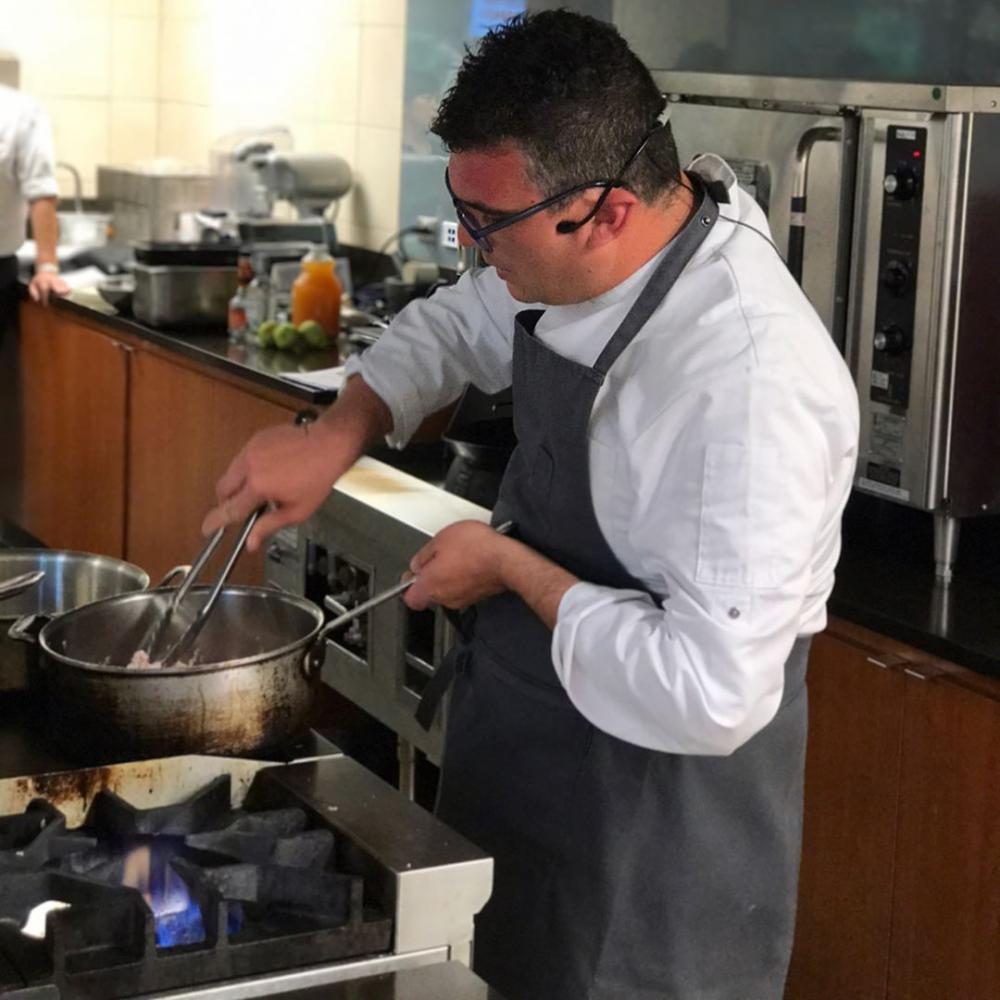 Guest Chef Felice Santodonato demonstrates Italian cuisine cooking tips for culinary arts students in SA-136 on May 1.