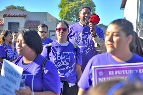 Richmond resident Raymond Smith (center) chants as the crowd reaches Pogo Park during the Citywide Walk event hosted by the Richmond Ceasefire in Richmond, Calif. on July 21. 