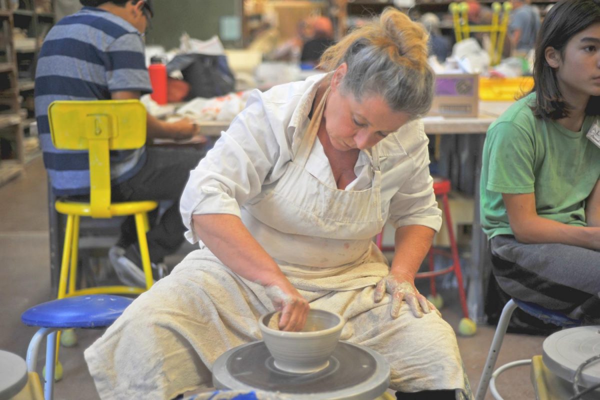 Volunteer Anne Van Blaricon
throws a
vase on a pottery wheel in the Art Building Monday for the Empty Bowls event, scheduled for Oct. 13 in the Aqua Terra Grill.