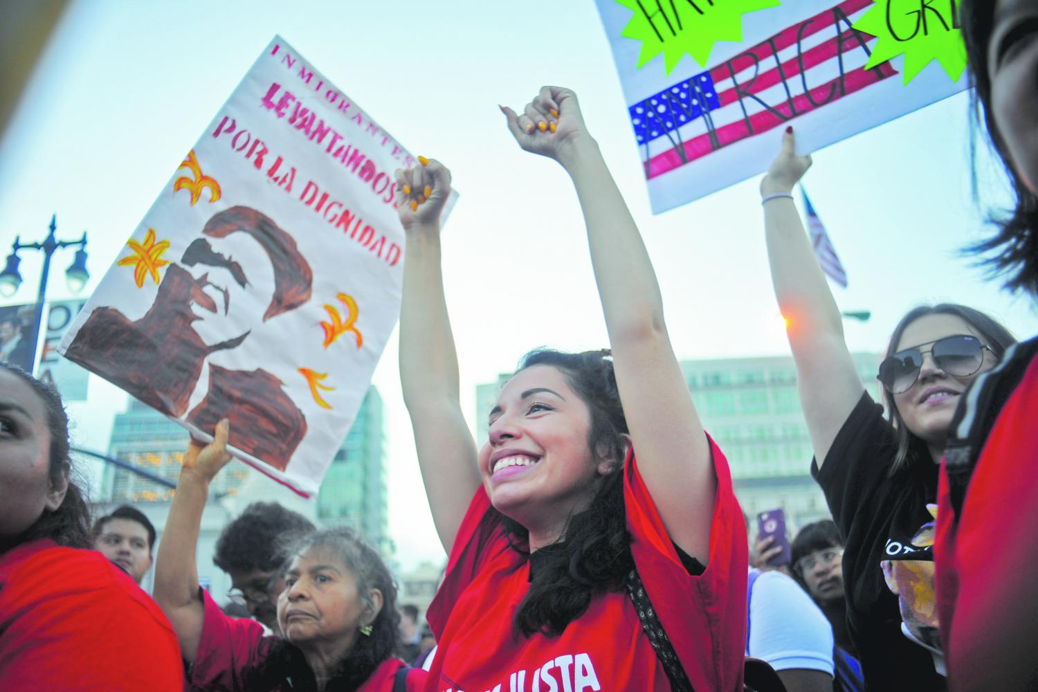 Oakland+resident+Yesenia+Veamatahau+holds+her+fists+in+the+air+as+a+speaker+performs+an+empowering+poem+during+the+closing+rally+of+an+impromptu+march+to+City+Hall+in+San+Francisco+on+Sept.+6.+