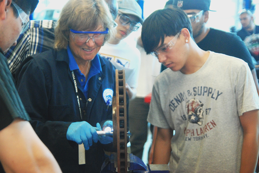 Automotive instructor Nancy Rupperecht demonstrates how to use a micrometer.