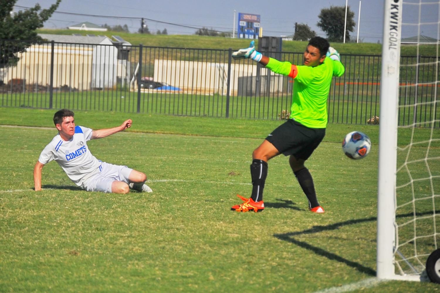 Comet foward Anthony Maytum scores on a volley against Ram goalkeeper Andres Castrajon during Contra Costa Colleges 6-2 defeat against Fresno City College on the Consumnes RIver College soccer field in Sacramento on Sunday. 