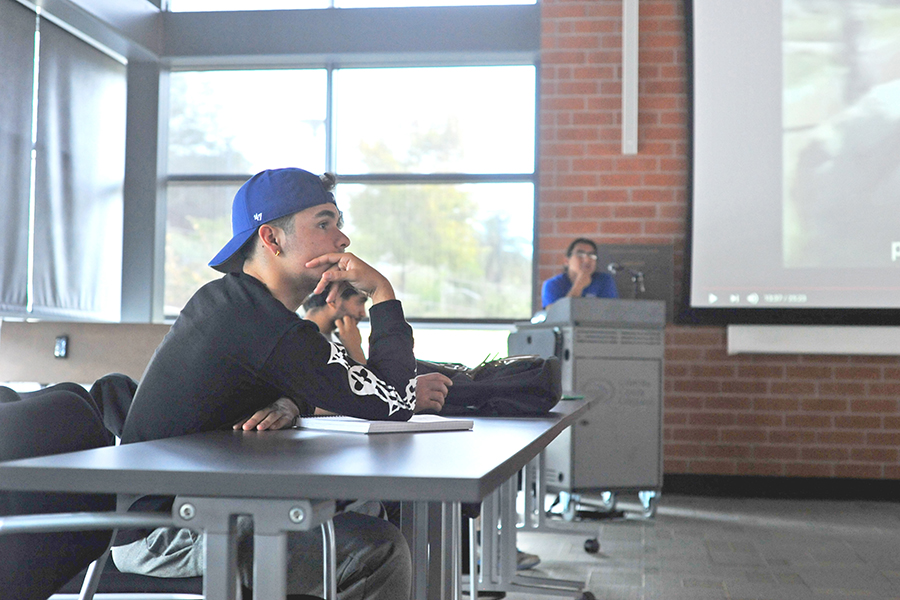 Communications major Andrew Magnoli listens to a seminar on
American militarism in Latin America delivered by Mexican journalist
Eduardo Garcia in the Fireside Hall on Sept. 18.