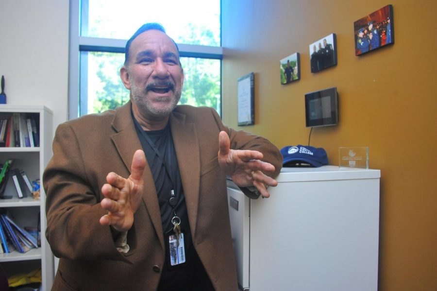 Rick Ramos explains the position he will take at Merritt College in Oakland starting next semester. 
Ramos also recalls his many experiences working at Contra Costa College 
for 30 years as he stands in his GE-113 office on Friday. 