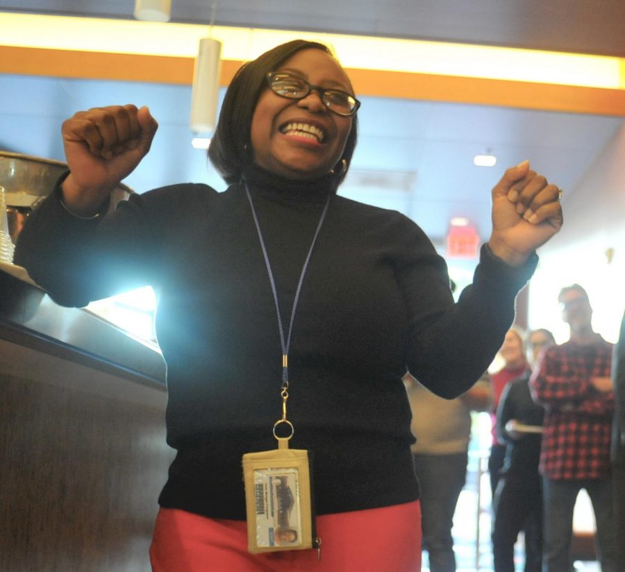Former Dean of Student Services Vikki Ferguson dances during a song being sung to her by attendees of her going away celebration in Aqua Terra Grill. 