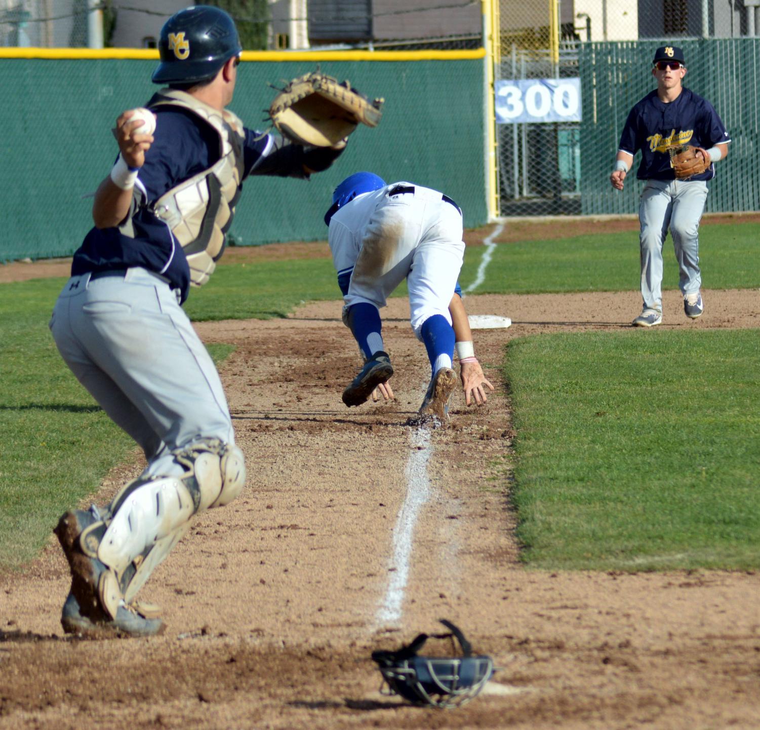 Comet infielder London Penland (middle) runs back to third attempting to stay safe in the ninth inning of Thursday’s loss to Mendocino College on the Baseball Field. The Comets lost 1-0.