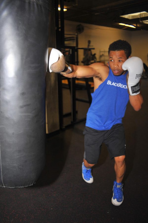Professional
welterweight boxer
Karim Mayfield
delivers a right straight to a heavy
bag in the 3rd
Street Gym in
San Francisco on
Thursday.