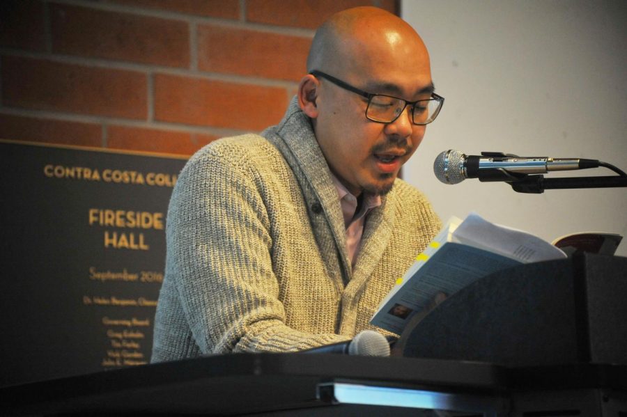 English professor Dickson Lam reads from his book, “Paper Sons: A Memoir” during his book signing event at Fireside Hall on Thursday.