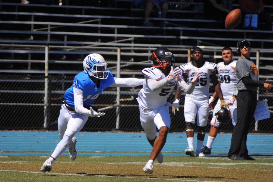 Reedley College Tiger cornerback James C. Day (right) intercepts Comet quarterback Jalen Tregle as wide receiver Kyree Jackson (left) looks on during Contra Costa College’s 50-20 loss on Saturday.
