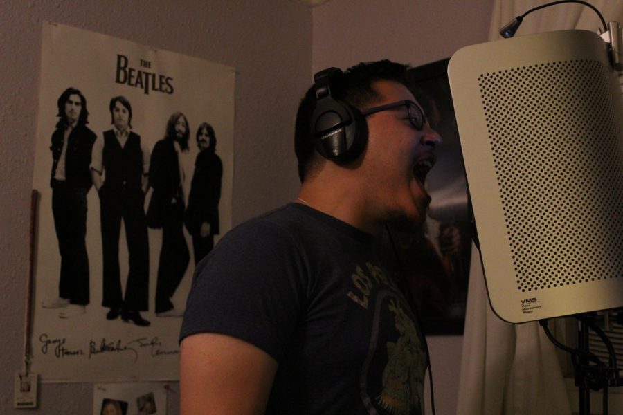 Associated Student Union Vice President Chris Miller sings during a recording session for his band, First Contact, in El Sobrante on Thursday. 