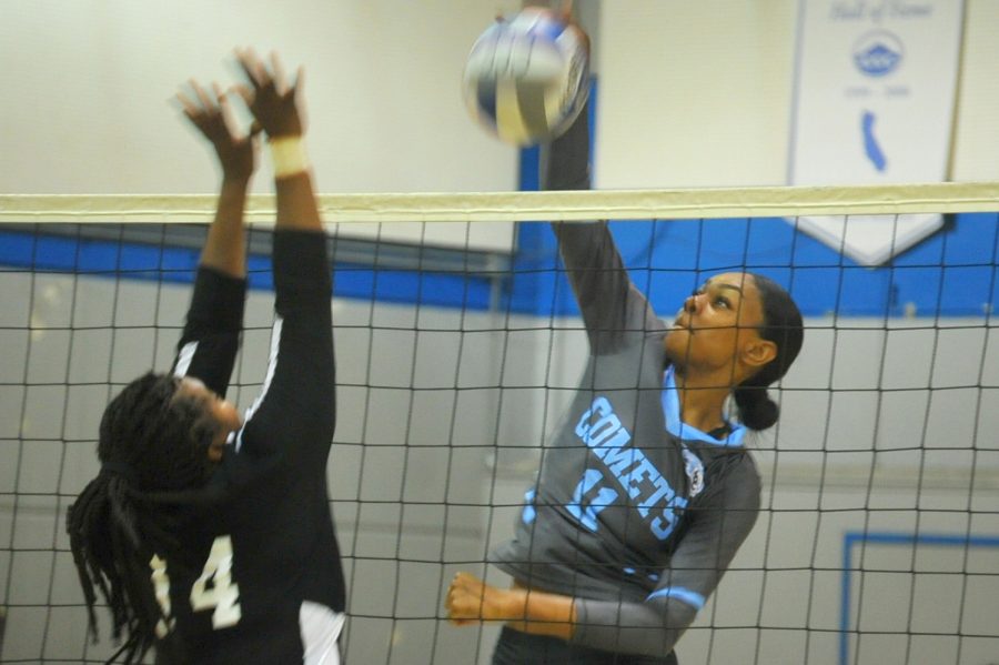 Middle blocker Makaya Thomas spikes the ball during a volleyball game this season