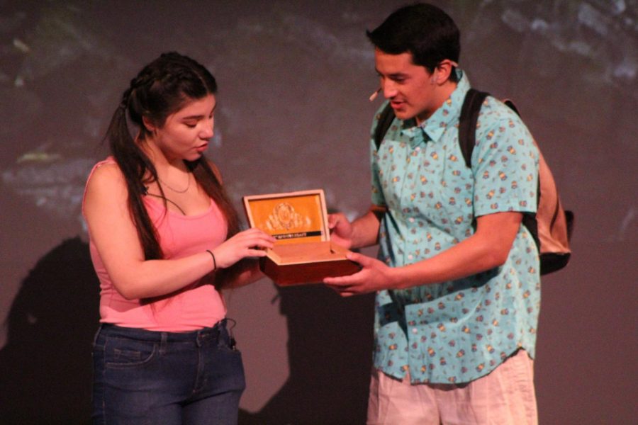 Yaz, played by Melissa Velasquez, and Elliot, played by Diego Loza, throw the ashes of their deceased mother into a waterfall during a scene in “Water by the Spoonful” in the Knox Center on Thursday.
