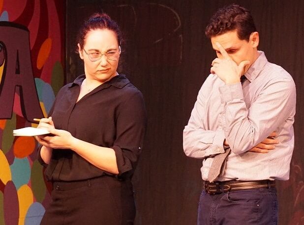 Annabel Glick (right), played by Maria 
Calderazzo, writes on a notepad as Harry Whiterspoon, played by Phillip Leyva, makes a facial expression during the production of “Lucky Stiff” at the Pinole Community Players. 
