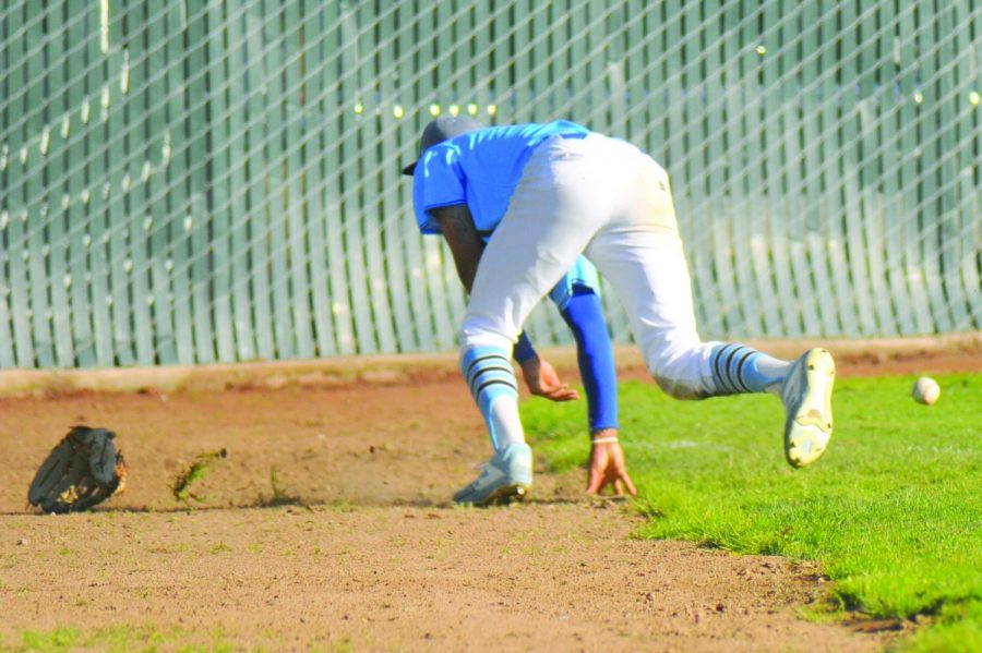 Outfielder Mychael Jamison  
loses his glove after he dove and missed the ball in the ninth inning 
 during Contra Costa College’s 1-10  loss against Solano Community
College on 
March 14 at the Baseball Field.  