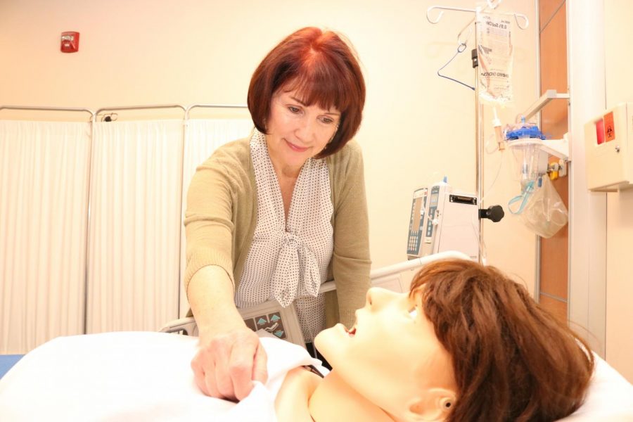 Dr. Cheri Etheredge 
cares for a simulation  mannequin in the Simulation Lab in the Applied Art Building. 
Etheredge has been 
teaching in Contra Costa College’s nursing department 
for 38 years. 
This semester she was awarded the district’s Teacher of the Year award. 
