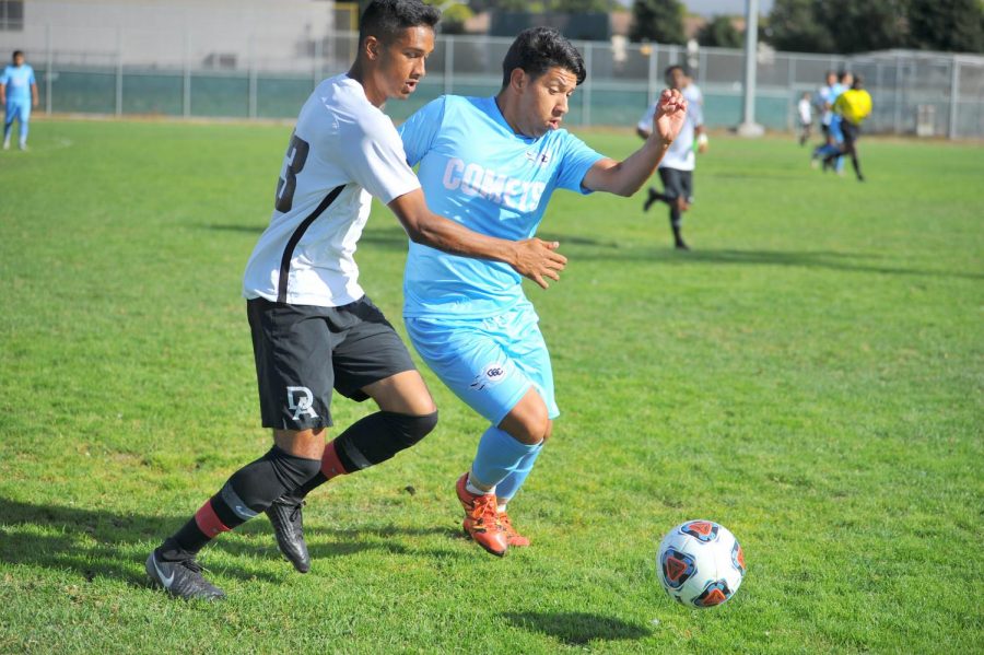 Comet midfielder Victor Rodriguez tackles a De Anza College midfielder during Contra Costa College’s 2-0 loss on Friday on the Soccer Field. 